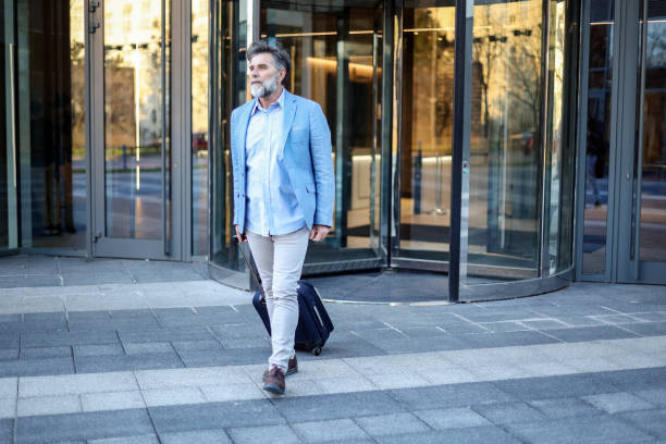Mature man on a city street. About 55 years old, Caucasian male.